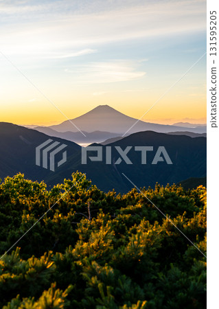 Mount Fuji during the magic hour as seen from the summit of Mount Minami in the Southern Alps. Climbing Mount Hijiri in the Southern Alps 131595205