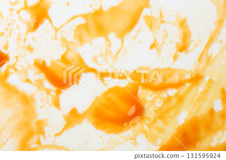 Closeup caramel sauce isolated on white background. Closeup caramel sauce isolated on white background. 131595924