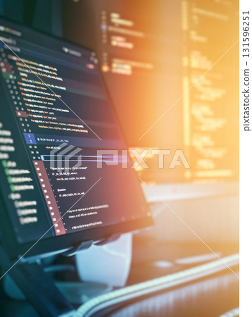 Modern programming workspace with glowing code display 131596251