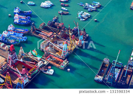 Aerial view of a port lined with containers 131598334