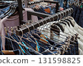 Hangers with clothes in the store. 131598825
