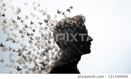 Man profile with butterflies flying from head, concept of mental health 131599400