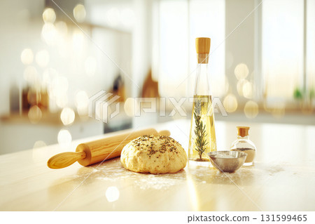 Homemade Bread Preparation Scene with Raw Dough Herbs Rolling Pin and Baking Ingredients on Wooden Countertop in Warm Kitchen Setting 131599465