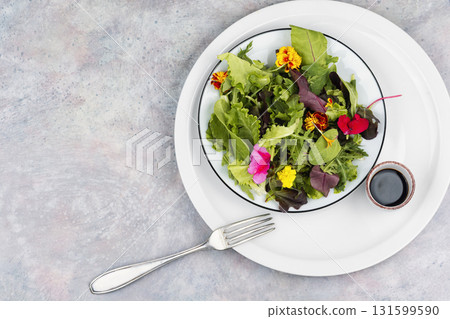 Vibrant Edible Flower Salad. 131599590