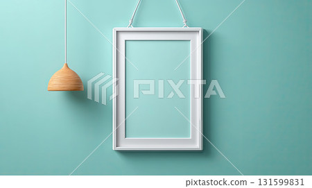 White frame hanging on blue wall with wooden pendant lamp 131599831