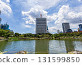Skyscrapers and blue sky over the pond at the former Shiba Rikyu Gardens in Tokyo, with the water surface in early autumn Skyscrapers and blue sky over the pond at the former Shiba Rikyu Gardens in Tokyo, with the water surface in early autumn 131599850