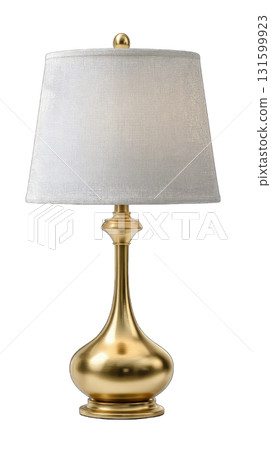 Modern gold table lamp with white fabric shade glowing warmly Modern gold table lamp with white fabric shade glowing warmly 131599923