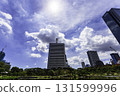 The early autumn sun shining on the skyscrapers at the Kyu-Shiba Rikyu Gardens in Tokyo, with blue skies and rays of light. The early autumn sun shining on the skyscrapers at the Kyu-Shiba Rikyu Gardens in Tokyo, with blue skies and rays of light. 131599996