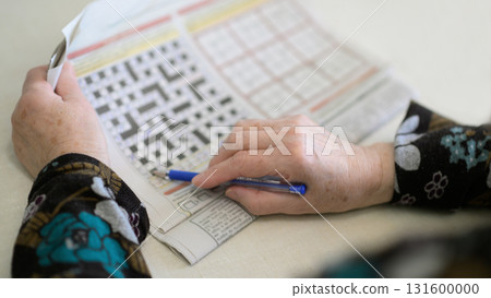 Elderly Woman Filling Crossword as Cognitive Exercise Elderly Woman Filling Crossword as Cognitive Exercise 131600000