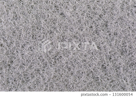 Macro view of texture surface of black kitchen scrubber sponge layer. Macro view of texture surface of black kitchen scrubber sponge layer. 131600054
