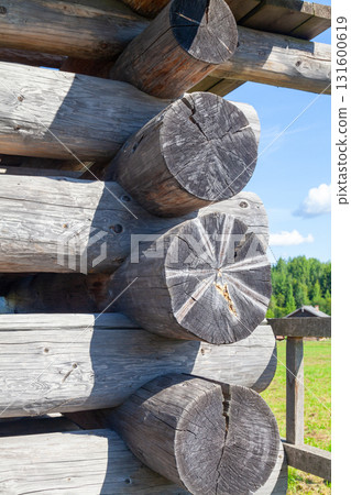 Corner of Wooden Log Cabin with Notched Joint, Close-Up Corner of Wooden Log Cabin with Notched Joint, Close-Up 131600619