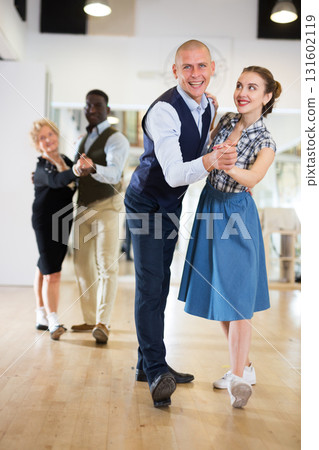 Man and woman learning to dance classical ballroom dance Man and woman learning to dance classical ballroom dance 131602119