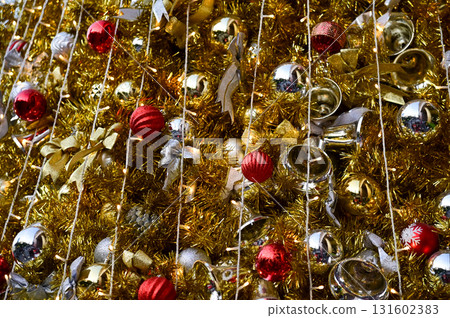 Close-up of the Christmas trees with colorful ornaments. Festive decoration. Full of ornaments. Winter season, winter festive. Christmas celebration, Xmas celebration. For background use. Close-up of the Christmas trees with colorful ornaments. Festive decoration. Full of ornaments. Winter season, winter festive. Christmas celebration, Xmas celebration. For background use. 131602383