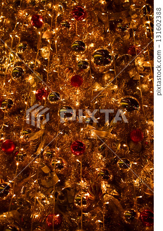 Close-up of the Christmas trees with colorful ornaments. Festive decoration. Full of ornaments. Winter season, winter festive. Christmas celebration, Xmas celebration. For background use. Close-up of the Christmas trees with colorful ornaments. Festive decoration. Full of ornaments. Winter season, winter festive. Christmas celebration, Xmas celebration. For background use. 131602388