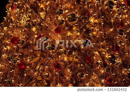 Close-up of the Christmas trees with colorful ornaments. Festive decoration. Full of ornaments. Winter season, winter festive. Christmas celebration, Xmas celebration. For background use. 131602432