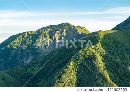 View of the morning glow of Mount Usagi from Mount Minami in the Southern Alps. Climbing Mount Hijiri in the Southern Alps View of the morning glow of Mount Usagi from Mount Minami in the Southern Alps. Climbing Mount Hijiri in the Southern Alps 131602563