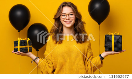 Happy satisfied smiling girl in 90s retro style on a yellow background with black balloons and black packages. Consumerism, sales, black friday. Online shopping. Happy satisfied smiling girl in 90s retro style on a yellow background with black balloons and black packages. Consumerism, sales, black friday. Online shopping. 131602977
