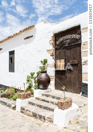 A white-walled building under bright sunlight in Betancuria, inland on Fuerteventura in the Canary Islands A white-walled building under bright sunlight in Betancuria, inland on Fuerteventura in the Canary Islands 131603457