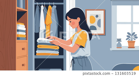 Young woman organizing clothes in closet Young woman organizing clothes in closet 131603519