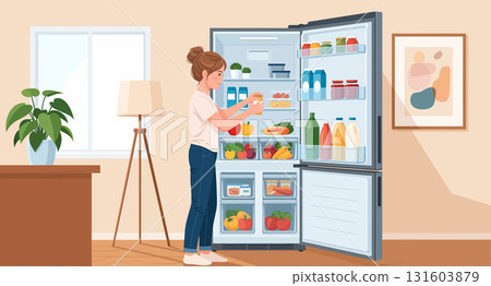 Young woman putting groceries in refrigerator 131603879