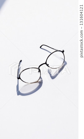 Reading Glasses Seen from Below Through Glass Table, Modern Minimal Perspective on White 131604121