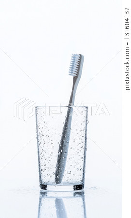 Worn Toothbrush Viewed Through Water Glass from Inside, Isolated Concept of Unusual Everyday Perspective 131604132