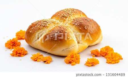 Pan de muerto on white, a cultural culinary symbol of remembrance for Mexican holiday themes 131604489