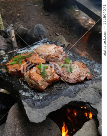 Juicy steak with asparagus on fire grill 131604571