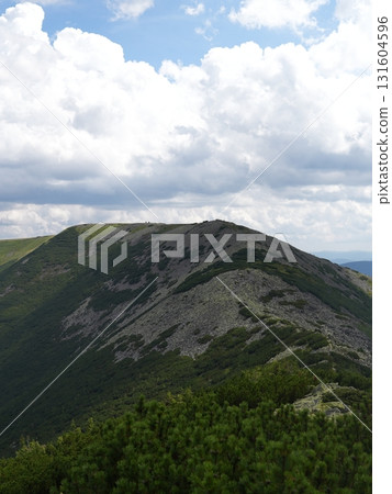 Beautiful mountain landscape, light over peaks and valleys, natural scenery, calm atmosphere and wild nature Beautiful mountain landscape, light over peaks and valleys, natural scenery, calm atmosphere and wild nature 131604596