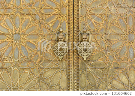 Brass doors adorned with Moroccan patterns, metal filigree, and intricate relief work. Royal Palace, Fez, Morocco 131604602