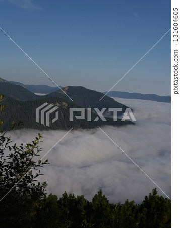 Beautiful mountain landscape, light over peaks and valleys, natural scenery, calm atmosphere and wild nature 131604605