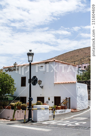 A white-walled building under bright sunlight in Betancuria, inland on Fuerteventura in the Canary Islands 131604609