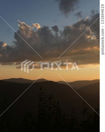 Beautiful mountain landscape, light over peaks and valleys, natural scenery, calm atmosphere and wild nature 131604619