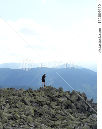 Beautiful mountain landscape, light over peaks and valleys, natural scenery, calm atmosphere and wild nature 131604630
