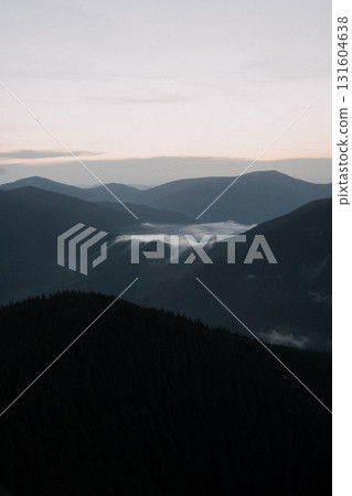 Beautiful mountain landscape, light over peaks and valleys, natural scenery, calm atmosphere and wild nature 131604638