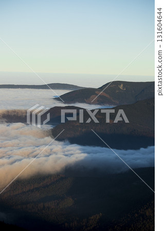 Beautiful mountain landscape, light over peaks and valleys, natural scenery, calm atmosphere and wild nature Beautiful mountain landscape, light over peaks and valleys, natural scenery, calm atmosphere and wild nature 131604644