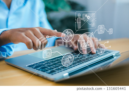 Industrial automation technology concept with engineer using laptop to control smart factory system Industrial automation technology concept with engineer using laptop to control smart factory system 131605441