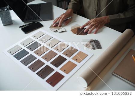 Architecture and Interior Designer man choosing interior materials. Architecture and Interior Designer man choosing interior materials. 131605822