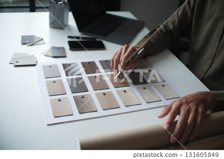 Architecture and Interior Designer man choosing interior materials. Architecture and Interior Designer man choosing interior materials. 131605849