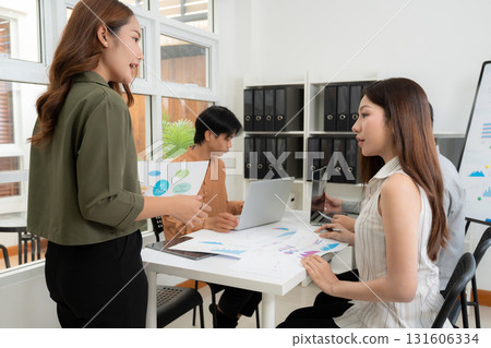 Group asian business team in office meeting, businesswoman presenting to colleague. Group asian business team in office meeting, businesswoman presenting to colleague. 131606334