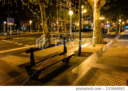 The empty streets of San Sebastian, lined with street lamps decorated for Christmas in the early morning 131606661