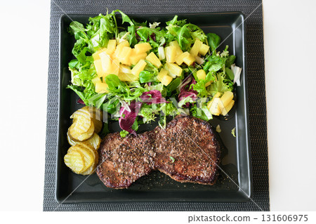 Healthy steak and salad meal on table at home Healthy steak and salad meal on table at home 131606975