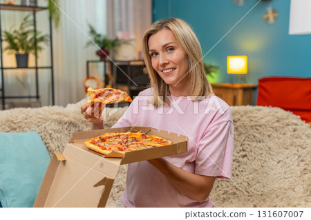 Pregnant woman opening pizza box inhaling hot aroma biting slice smiling enjoying delicious dinner Pregnant woman opening pizza box inhaling hot aroma biting slice smiling enjoying delicious dinner 131607007