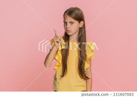Child girl kid shaking head showing hand gesture no, expressing refusal or disapproval emotionally Child girl kid shaking head showing hand gesture no, expressing refusal or disapproval emotionally 131607083