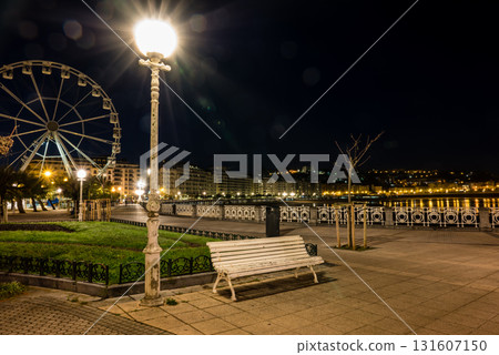 Large, bright streetlights and a Ferris wheel in the distance: San Sebastian's nightscape Large, bright streetlights and a Ferris wheel in the distance: San Sebastian's nightscape 131607150