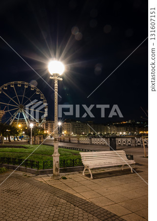 Large, bright streetlights and a Ferris wheel in the distance: San Sebastian's nightscape Large, bright streetlights and a Ferris wheel in the distance: San Sebastian's nightscape 131607151