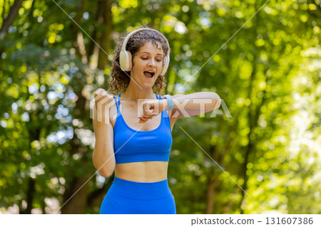 Athletic fitness sport runner woman finishing racing competition victory success workout cardio 131607386