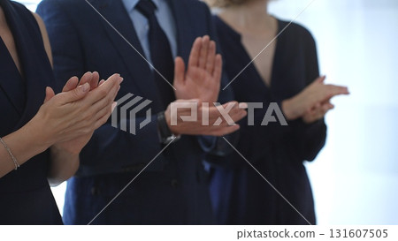 Business people are clapping hands, expressing gratitude and acknowledging a successful performance or presentation, creating a positive and encouraging atmosphere in a professional setting 131607505