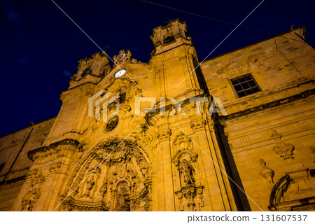 The old town of San Sebastian, Spain, before dawn: deserted cobblestone streets, streetlights and historic buildings The old town of San Sebastian, Spain, before dawn: deserted cobblestone streets, streetlights and historic buildings 131607537