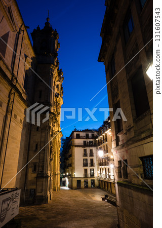 The old town of San Sebastian, Spain, before dawn: deserted cobblestone streets, streetlights and historic buildings The old town of San Sebastian, Spain, before dawn: deserted cobblestone streets, streetlights and historic buildings 131607543
